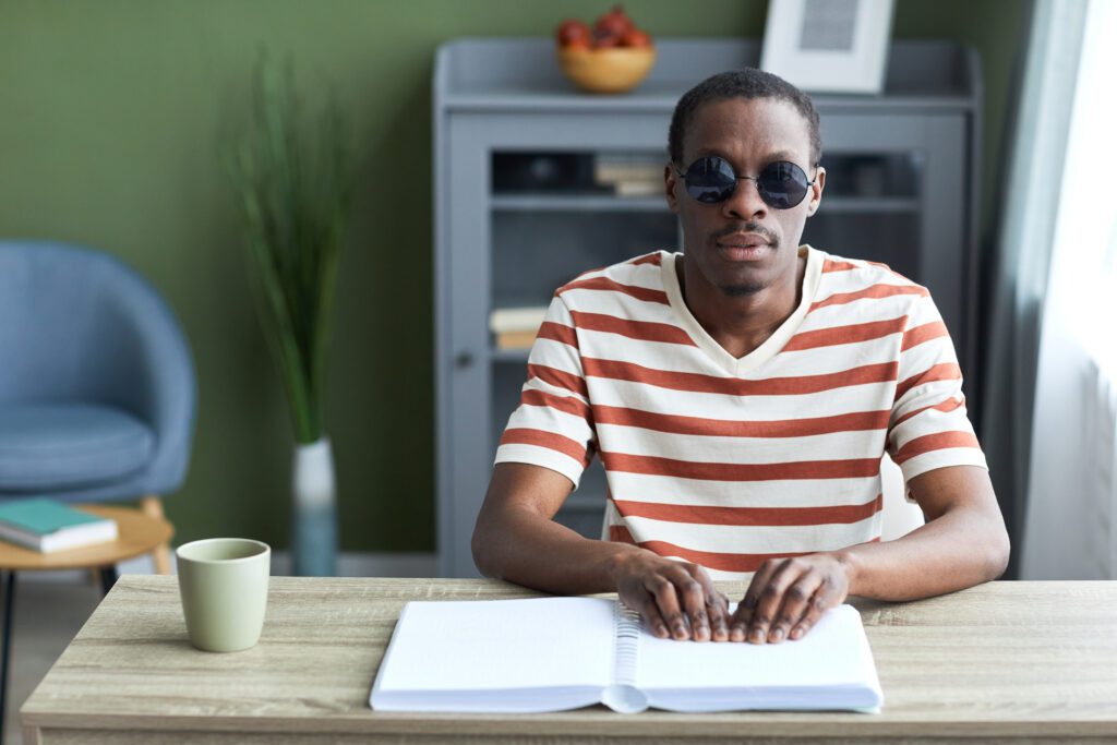 blind man reading a book